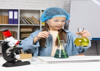 girl with hair net doing science experiments 1